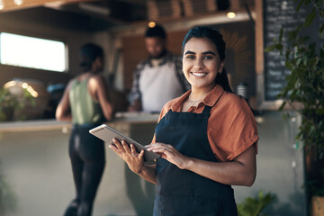 Person using digital tablet in a bustling cafe environment - 3webindia.com